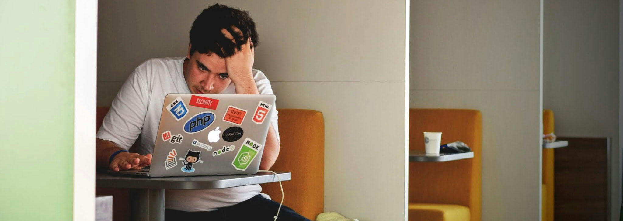 Tom doesn’t understand where this IDE0100 error is coming from, but is he really a .NET dev? This PHP sticker is suspicious! (photo by Tim Gouw on pexels.com)